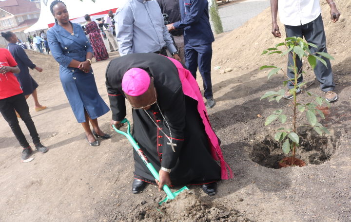 Bishop John Oballa Owaa Planting tree at Sts. John and Sylvia Kitengela